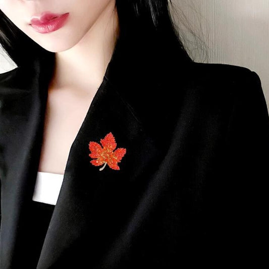 Autumn-inspired luxury brooch in red-orange tones