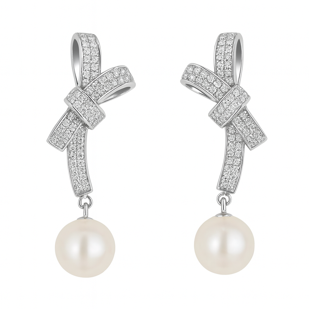 Bow and pearl drop earrings in sterling silver

