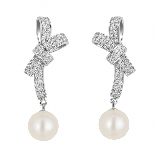 Bow and pearl drop earrings in sterling silver

