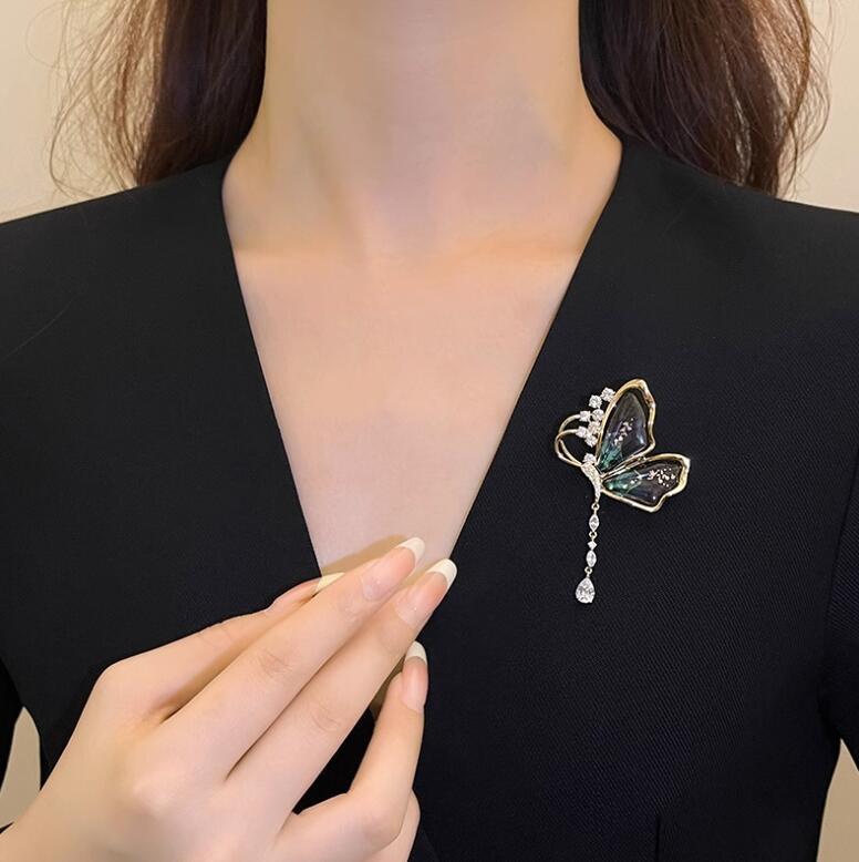 Gold enamel butterfly pin with sparkling rhinestones

