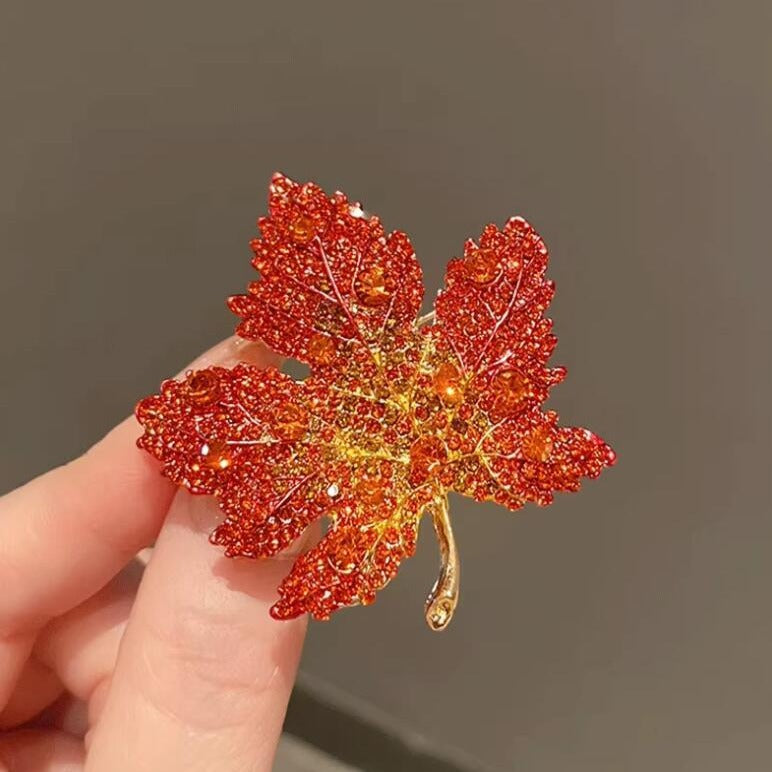 Handcrafted maple leaf brooch in red and gold finish