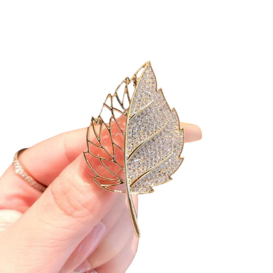 Gold hollow leaf broach with sparkling crystal inlay