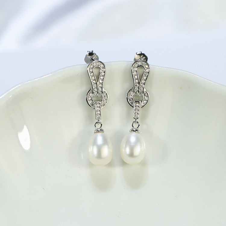 Luxury pearl drop earrings with unique constellation shape