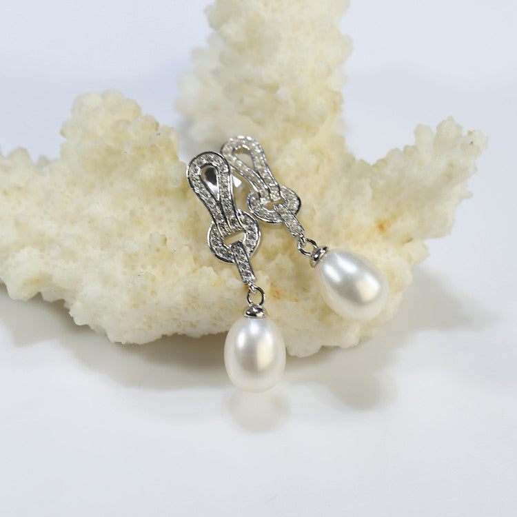 AAA-grade white pearl earrings with modern silver top