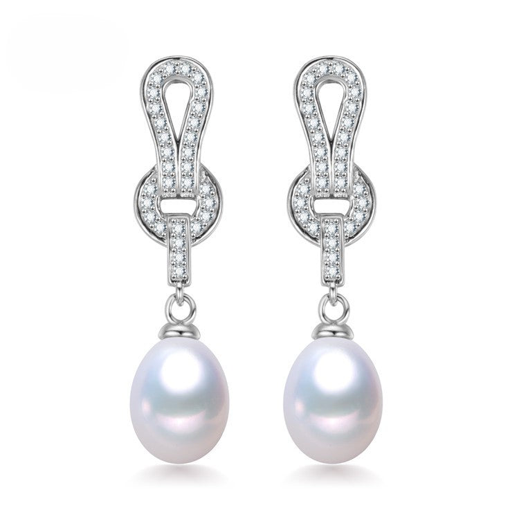 Handcrafted drop pearl earrings with constellation design