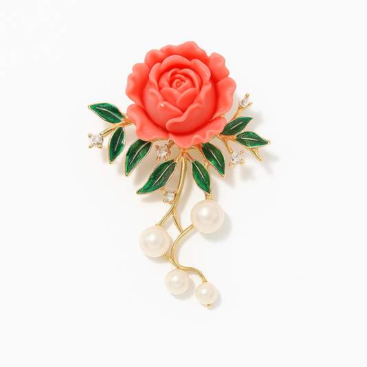 Red sculpted rose brooch with green enamel leaves and pearls