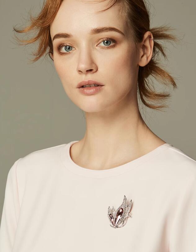 Silver and purple butterfly-shaped brooch