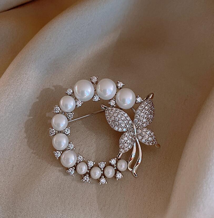 Silver butterfly brooch with pearls and rhinestones