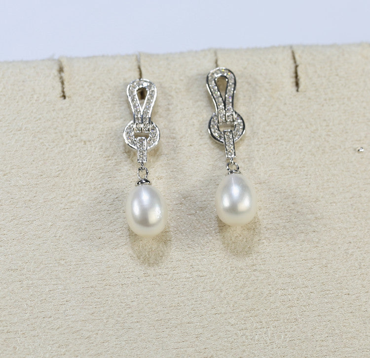 Elegant claw-set pearl earrings for women