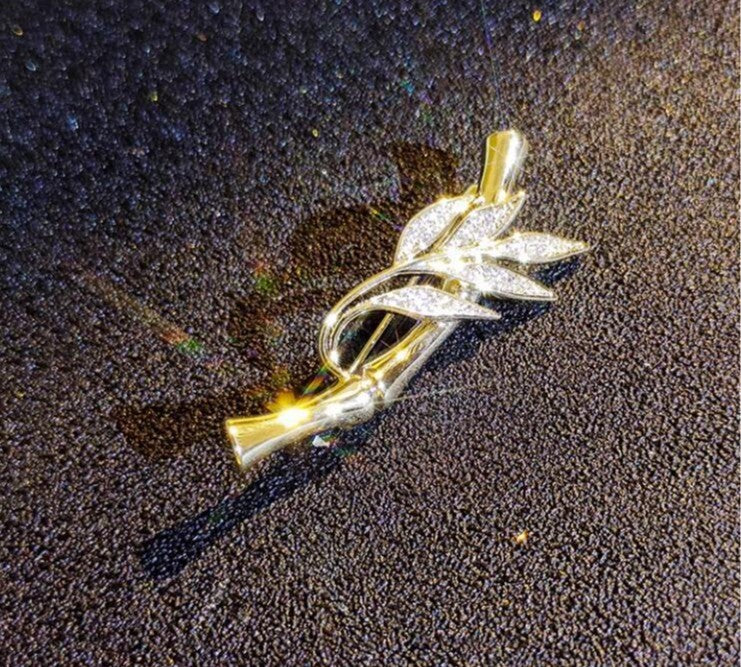 bamboo leaf brooch with crystal accents