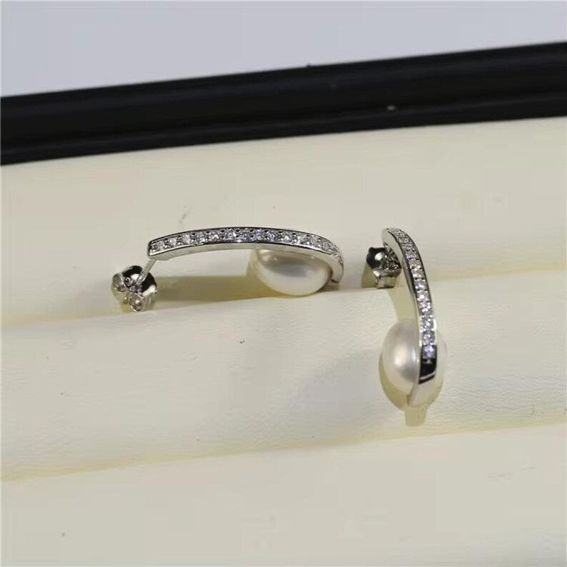 925 silver drop earrings with luminous freshwater pearls and pave cubic zirconia detailing

